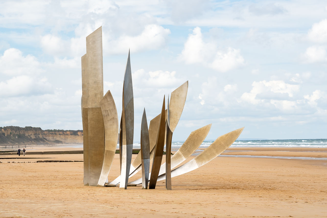 Metal sculpture on sandy beach